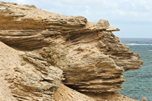 Limestone outcrop showing classic cross bedding created by ancient dune sands Limestone outcrop showing classic cross bedding created by ancient dune sands