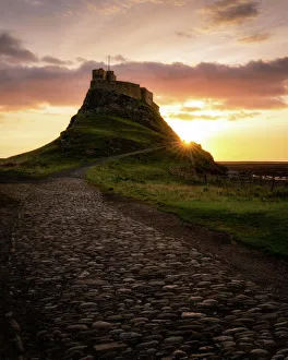 Lindisfarne Castle at sunrise, Holy Island, Northumberland, England, United Kingdom Lindisfarne Castle at sunrise, Holy Island, Northumberland, England, United Kingdom