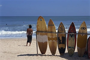 A line of surfboards waiting for hire at Kuta beach A line of surfboards waiting for hire at Kuta beach