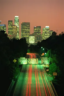 Los Angeles skyline and freeway, illuminated at night, California Los Angeles skyline and freeway, illuminated at night, California