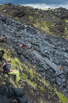 Tolbachik Volcano Prints: Man watching an active lava stream, Tolbachik volcano, Kamchatka, Russia, Eurasia