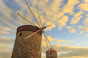 Mandraki Harbour medieval windmills at sunset, Rhodes, Dodecanese, Greek Islands Mandraki Harbour medieval windmills at sunset, Rhodes, Dodecanese, Greek Islands