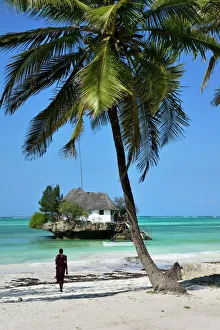 Masai tribesman on Bwejuu Beach, The Rock Restaurant, Zanzibar, Tanzania, Indian ocean Masai tribesman on Bwejuu Beach, The Rock Restaurant, Zanzibar, Tanzania, Indian ocean