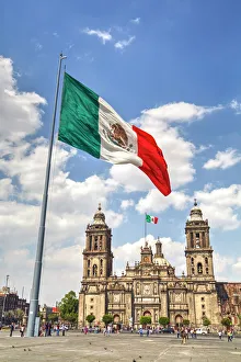 Mexican flag, Plaza of the Constitution (Zocalo), Metropolitan Cathedral in background Mexican flag, Plaza of the Constitution (Zocalo), Metropolitan Cathedral in background