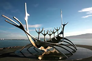 The midnight sun lights up the giant steel boat sculpture that stands on the waters edge at Reykjavik, Iceland The midnight sun lights up the giant steel boat sculpture that stands on the waters edge at Reykjavik, Iceland