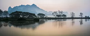 Images Dated 7th March 2016: Misty morning at Kyauk Kalap Buddhist Temple at sunrise, Hpa An, Kayin State, Myanmar