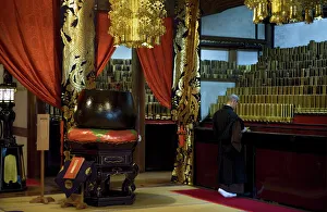 Monk inside Shidoden Memorial Hall at Eiheiji Temple, headquarters of the Soto sect of Zen Buddhism Monk inside Shidoden Memorial Hall at Eiheiji Temple, headquarters of the Soto sect of Zen Buddhism