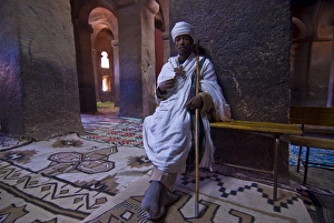 Monk sitting in the rock carved monastery of Lalibela, Northern Ethiopia, Africa Monk sitting in the rock carved monastery of Lalibela, Northern Ethiopia, Africa