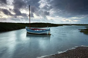 A moody and windy summer evening at Brancaster Staithe, North Norfolk, England A moody and windy summer evening at Brancaster Staithe, North Norfolk, England