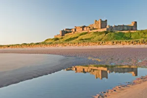 Morning light on the beach at Bamburgh Castle, Northumberland, England Morning light on the beach at Bamburgh Castle, Northumberland, England