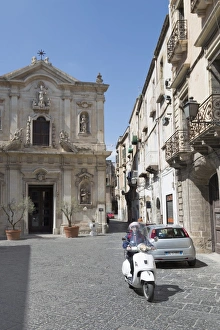 Motor scooter and Cattedrale di San Cataldo in Taranto, Basilicata, Italy, Europe Motor scooter and Cattedrale di San Cataldo in Taranto, Basilicata, Italy, Europe