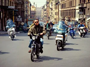Motorbikes and scooters crossing the Piazza Barberini Motorbikes and scooters crossing the Piazza Barberini