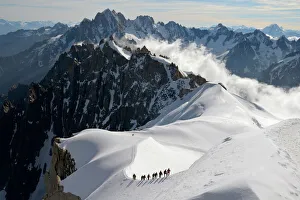 Mountaineers and climbers, Aiguille du Midi, Mont Blanc Massif, Chamonix, Haute Savoie Mountaineers and climbers, Aiguille du Midi, Mont Blanc Massif, Chamonix, Haute Savoie