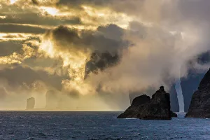 Mykines coastline at sunrise, Faroes, Denmark, Europe Mykines coastline at sunrise, Faroes, Denmark, Europe