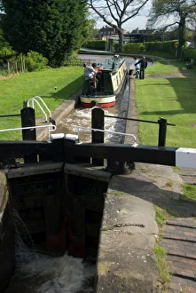 Narrow boat on the Llangollen Canal going through the locks at Grindley Brook Narrow boat on the Llangollen Canal going through the locks at Grindley Brook