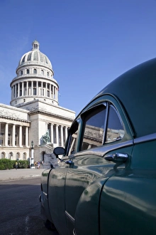 Old American car parked near the Capitolio building, Havana, Cuba, West Indies Old American car parked near the Capitolio building, Havana, Cuba, West Indies