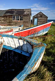 Old fishing boats and delapidated fishermens huts, Beadnell, Northumberland Old fishing boats and delapidated fishermens huts, Beadnell, Northumberland