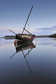 Old ketch reflecting in Aln Estuary as tide rises, Alnmouth, Northumberland Old ketch reflecting in Aln Estuary as tide rises, Alnmouth, Northumberland