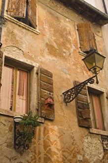 Lazise Italy Prints: Old wall with shuttered windows