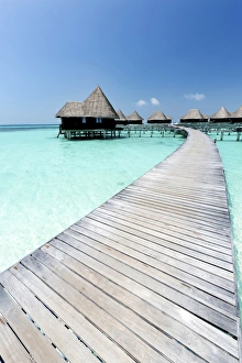 Over-water villas, crystal clear sea and blue sky, Coco Palm, Dhuni Kolhu, Baa Atoll Over-water villas, crystal clear sea and blue sky, Coco Palm, Dhuni Kolhu, Baa Atoll