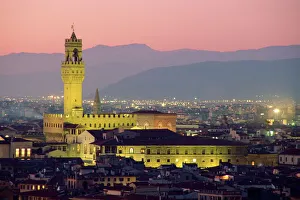 Prints of The Palazzo Vecchio, seen illuminated at dusk from the Piazzale Michelangelo, Florence, Tuscany, Italy, Europe Florence Prints: Print of The Palazzo Vecchio at Dusk