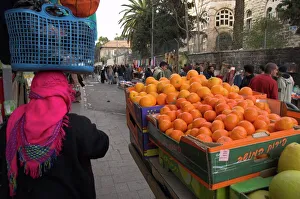 Palestinian woman in colourful scarf and carrying bag Palestinian woman in colourful scarf and carrying bag