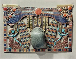 Pectoral decorated with winged scarab, protected by the goddesses Isis and Nephthys Pectoral decorated with winged scarab, protected by the goddesses Isis and Nephthys
