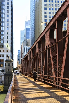 Pedestrians crossing a bridge over the Chicago River, Chicago, Illinois, United States of America, North America Pedestrians crossing a bridge over the Chicago River, Chicago, Illinois, United States of America, North America