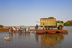 People and truck crossing the Manambolo River, Tsingy de Bemaraha, Madagascar, Africa People and truck crossing the Manambolo River, Tsingy de Bemaraha, Madagascar, Africa