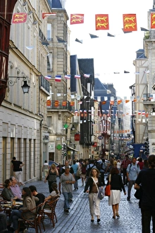 People walking along the Rue du Gros Horloge, the main street of old Rouen People walking along the Rue du Gros Horloge, the main street of old Rouen