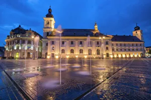 Prints of Piata Mare (Great Square) at night, with Sibiu City Hall on left and Sibiu Baroque Jesuit Church on right, Transylvania, Romania, Europe Romania Prints: Nighttime Print of Sibiu's Great Square with City Hall and Jesuit Church