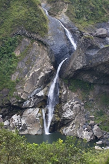 One of many picturesque waterfalls in the valley of the Rio Pastaza that flows from One of many picturesque waterfalls in the valley of the Rio Pastaza that flows from