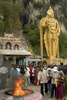 Pilgrims throwing offerings into holy fire during the Pilgrims throwing offerings into holy fire during the