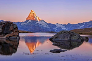 Pink sky at sunrise on the Matterhorn reflected in Stellisee, Zermatt, Canton of Valais Pink sky at sunrise on the Matterhorn reflected in Stellisee, Zermatt, Canton of Valais