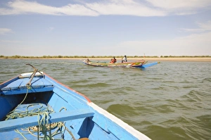 Pirogue or fishing boat on the backwaters of the Sine Saloum Delta, Senegal Pirogue or fishing boat on the backwaters of the Sine Saloum Delta, Senegal