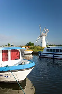 Pleasure boats moored beside Thurne windmill, Norfolk Broads, Thurne, Norfolk Pleasure boats moored beside Thurne windmill, Norfolk Broads, Thurne, Norfolk