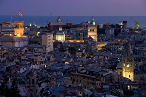 Port and cityscape at dusk, Genoa, Liguria, Italy, Europe Port and cityscape at dusk, Genoa, Liguria, Italy, Europe