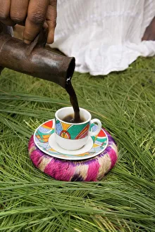 Pouring coffee during a coffee ceremony, Ethiopia, Africa Pouring coffee during a coffee ceremony, Ethiopia, Africa