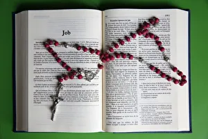 Prayer beads over an open Bible, Eure, France, Europe Prayer beads over an open Bible, Eure, France, Europe