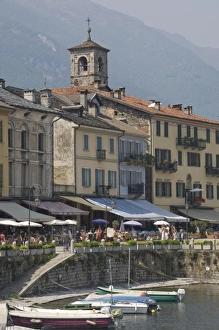 Promenade cafes by the old harbour, Cannobio, Lago Maggiore, Switzerland, Europe Promenade cafes by the old harbour, Cannobio, Lago Maggiore, Switzerland, Europe