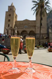 Prints of Prosecco wine on cafe table, cathedral behind, Piazza Duomo, Cefalu, Sicily, Italy, Europe Cefalu Prints: Prosecco Print on Cafe Table