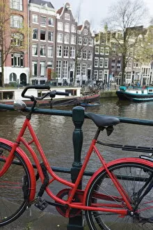 Netherlands Collection: Red bicycle by the Herengracht canal, Amsterdam, Netherlands, Europe