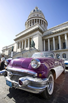 Restored classic American car parked outside The Capitilio, Havana, Cuba Restored classic American car parked outside The Capitilio, Havana, Cuba