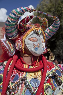 Revellers in costumes and masks at Humahuaca carnival in Jujuy province in the Andes Revellers in costumes and masks at Humahuaca carnival in Jujuy province in the Andes