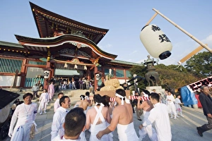 Rice bales being carried at Hadaka Matsuri (Naked Festival), Hofu city Rice bales being carried at Hadaka Matsuri (Naked Festival), Hofu city