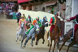 Horses Collection: Riders racing at El Palio horse race festival, Piazza del Campo, Siena