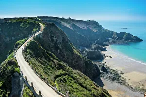 Road connecting the narrow isthmus of Greater and Little Sark, Channel Islands Road connecting the narrow isthmus of Greater and Little Sark, Channel Islands