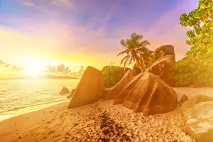 African Ocean Views Prints: Rocks on beach and palm trees, Anse Source d Argent at sunset, La Digue, Seychelles