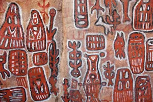 Sacred rock paintings on cliff depicting Dogon customs and stories in Songo Sacred rock paintings on cliff depicting Dogon customs and stories in Songo