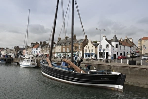Sailing Herring Drifter moored in harbour, Anstruther, Fife Coast, Scotland, United Kingdom Sailing Herring Drifter moored in harbour, Anstruther, Fife Coast, Scotland, United Kingdom